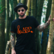 man wearing ARP vintage style tee in bamboo forest